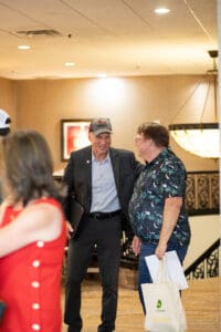 Two men talking in a hotel lobby.