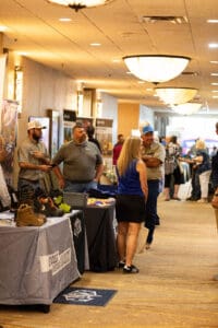 People interacting at a trade show event.