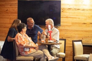 Group of people chatting at a table.