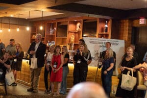 People gathered at a welcoming reception event.