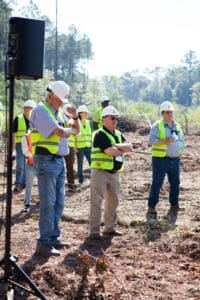 Construction workers wearing hard hats on site