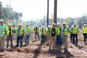 Construction crew in safety vests at clearing