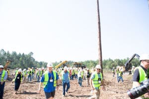 Construction workers gathered at a work site.
