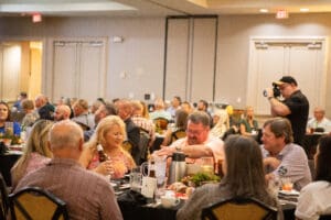People dining at a large banquet event.