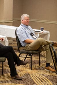 Man sitting in a conference room.
