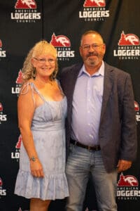 Man and woman at American Loggers event.