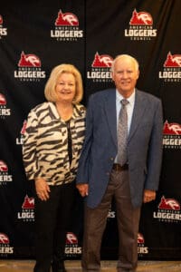 Two people at American Loggers Council event.