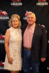 Man and woman at American Loggers Council event.