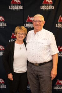 Smiling couple at American Loggers Council event.