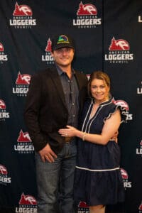 Couple posing at American Loggers Council event.