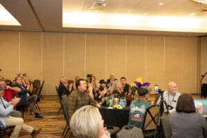 People seated at a conference event.