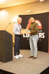 Two men at an award presentation event.