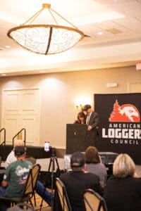 People speaking at American Loggers Council event.
