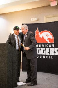 Two men at American Loggers Council event.