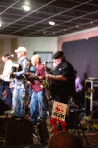 Band performing on stage at an event.