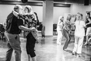 People dancing in a lively social setting.