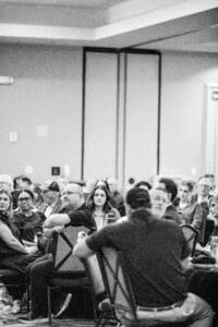 Audience attentively listening at a conference event.