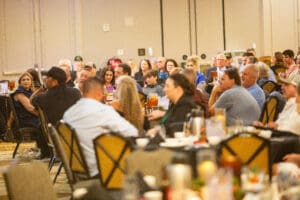 Audience seated at a conference event.
