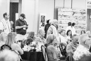 Black-and-white conference crowd at banquet