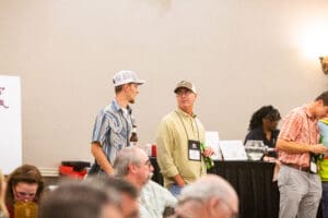 People conversing at a conference event.