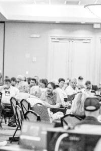 People attending a conference in a room.