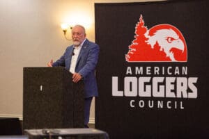 Man speaking at American Loggers Council event.