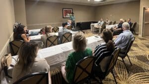 People attending a meeting in a conference room.
