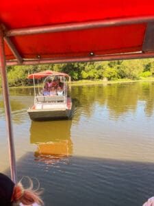 Two boats on a calm river.